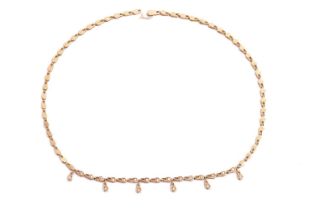 A diamond-set fringe necklace in 18ct yellow gold, comprising of a series of hayseed links with