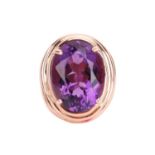 A large amethyst cocktail ring, centred with an oval-cut amethyst approximately measuring 20.1 x 15.