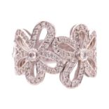 A diamond-set floral dress ring, pierced mount of flowerheads encrusting with round brilliant-cut di