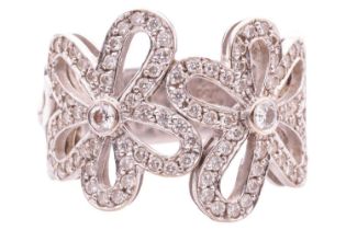 A diamond-set floral dress ring, pierced mount of flowerheads encrusting with round brilliant-cut