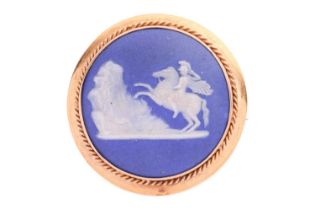A Victorian Wedgwood Jasperware brooch, of circular form, depicting Marcus Curtius on horseback