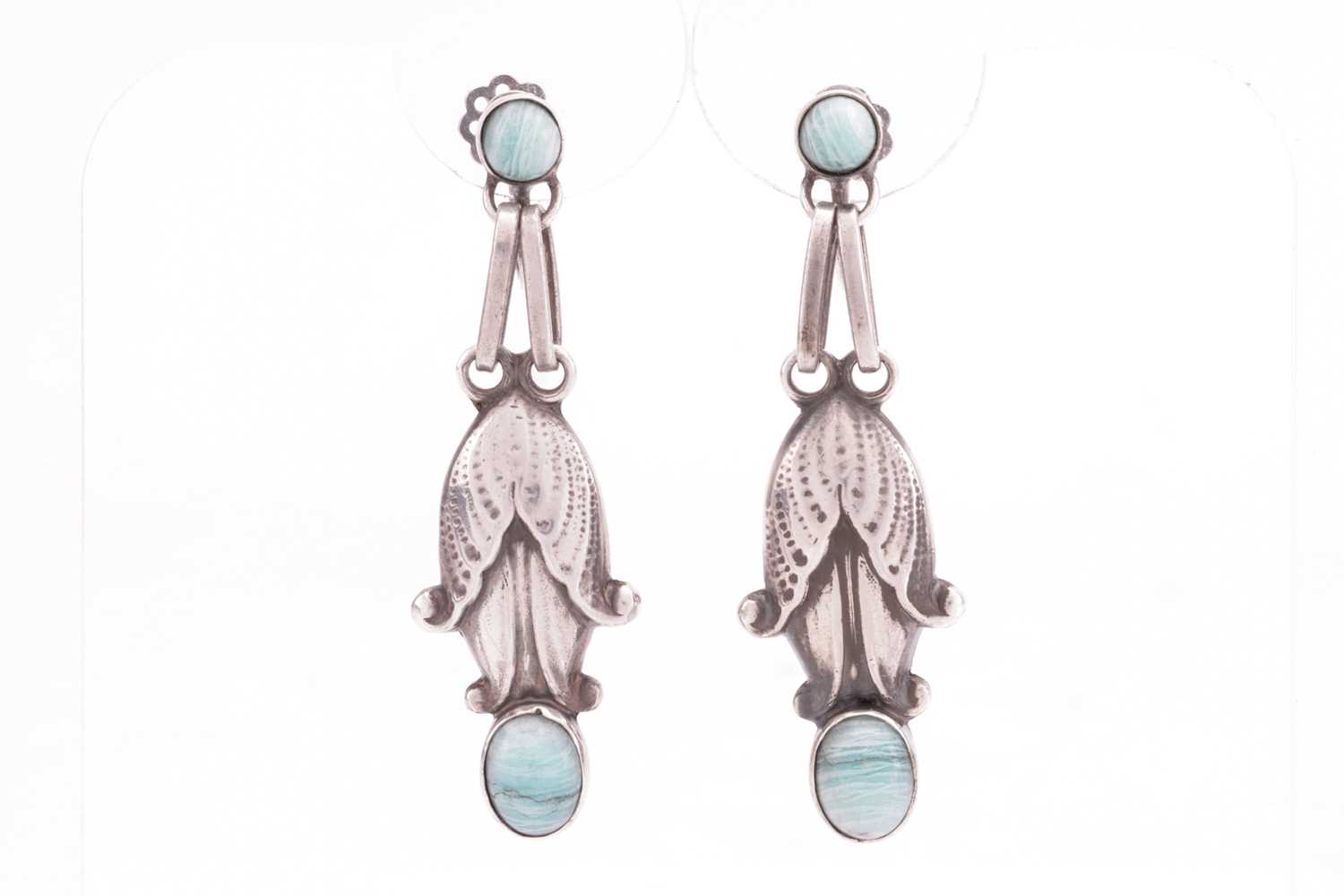 Georg Jensen - a pair of floral drop earrings set with amazonite, stylised as textured flowerheads, 