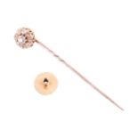 A 19th century diamond cluster stick pin convertible to dress stud, featuring an old cut diamond clu