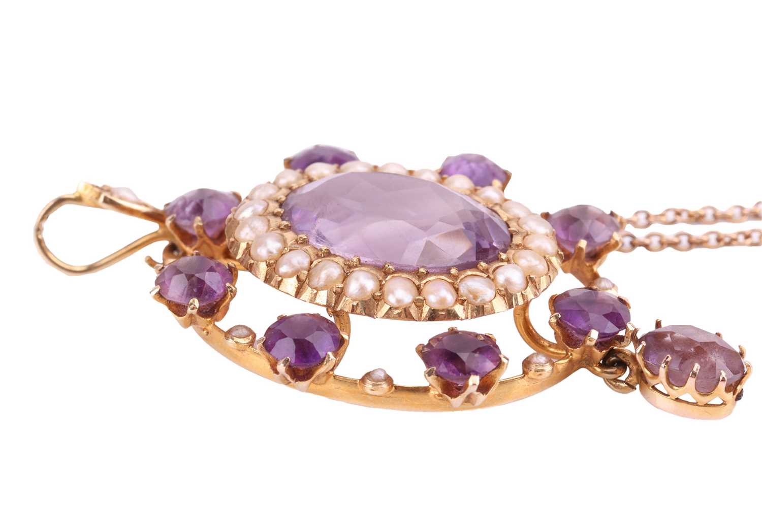 An Edwardian amethyst and seed pearl pendant, the central oval amethyst measuring approximately 13.5 - Image 2 of 3