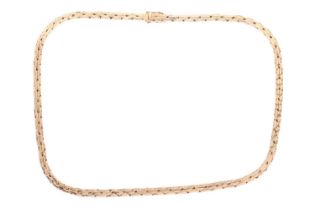 A flat cobra link necklace in 18ct yellow gold, completed with a push-button clasp and secured
