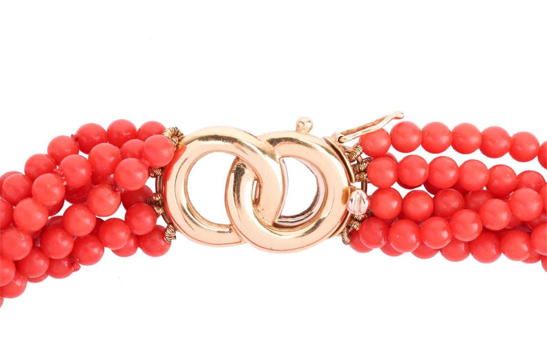 A coral torsade necklace, comprising seven strands of coral beads, completed with a clasp of annular - Image 4 of 4
