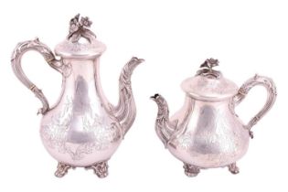 A Victorian teapot and coffee pot, low-bellied with leaf-mounted vine handles and spouts, scroll and