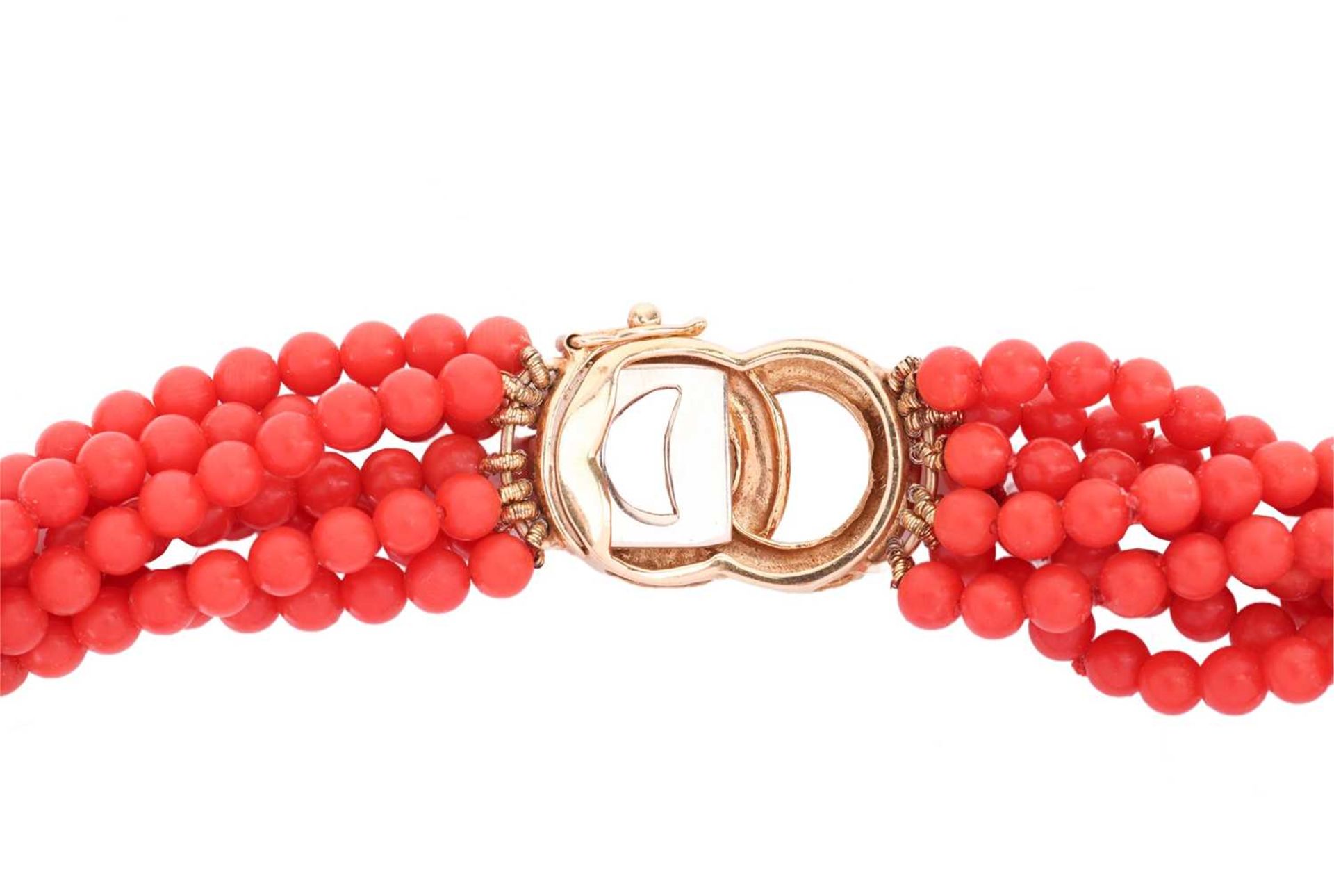 A coral torsade necklace, comprising seven strands of coral beads, completed with a clasp of annular - Image 3 of 4