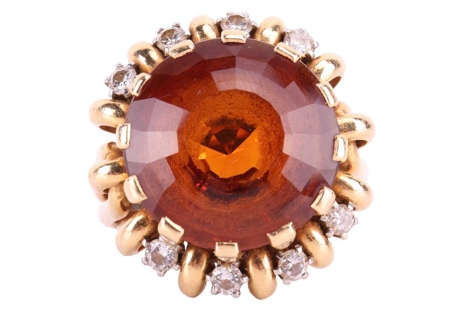 Carl Bucherer - a citrine and diamond dress ring, the round faceted citrine in claw setting above a 