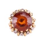 Carl Bucherer - a citrine and diamond dress ring, the round faceted citrine in claw setting above a 