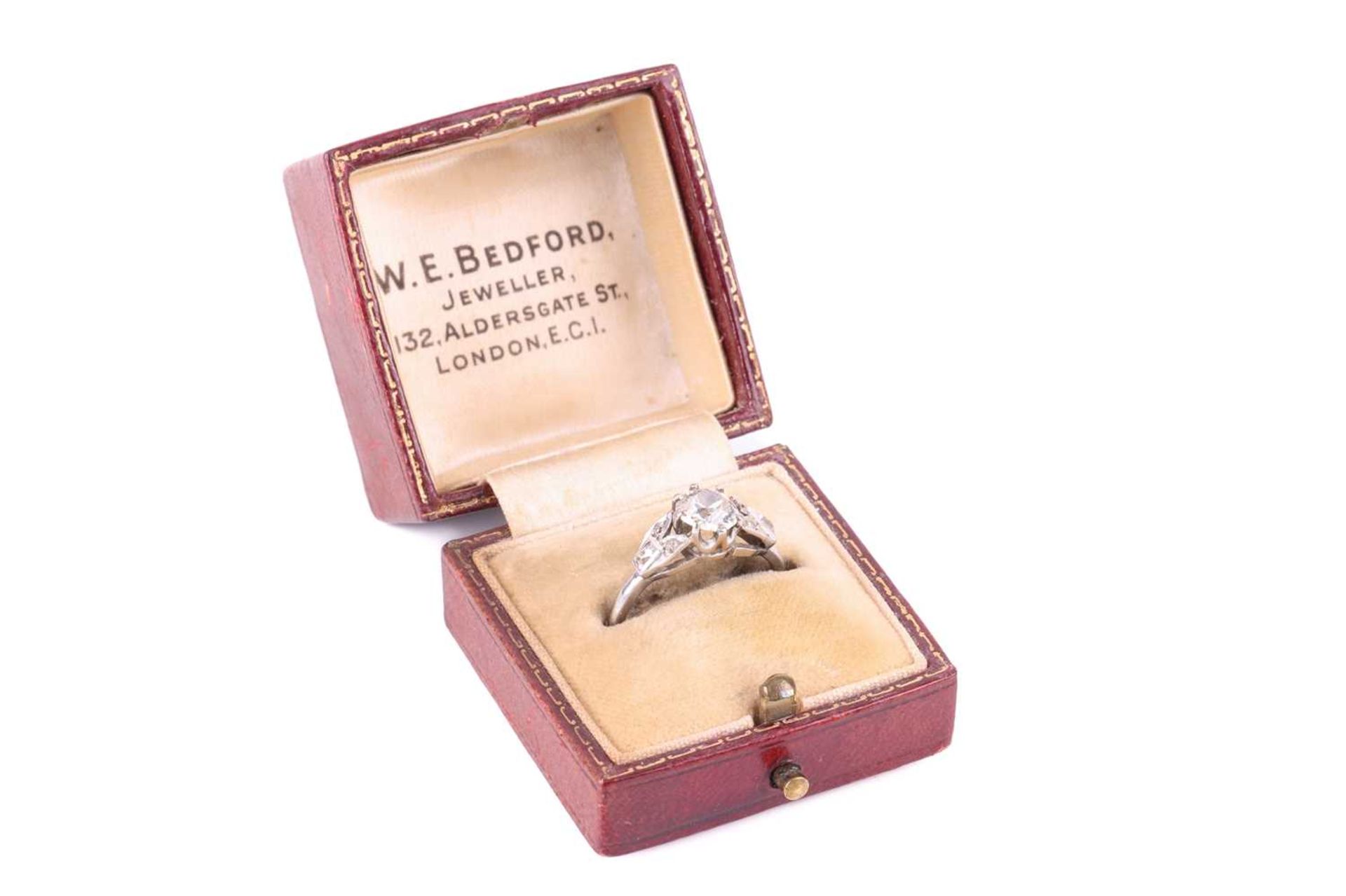 An old cut diamond solitaire ring with diamond set shoulders, circa 1920s, featuring a round old cut - Image 5 of 5