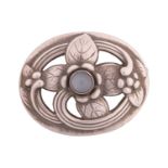 Georg Jensen - an oval floral brooch set with moonstone, openwork surround embossed and chased with 