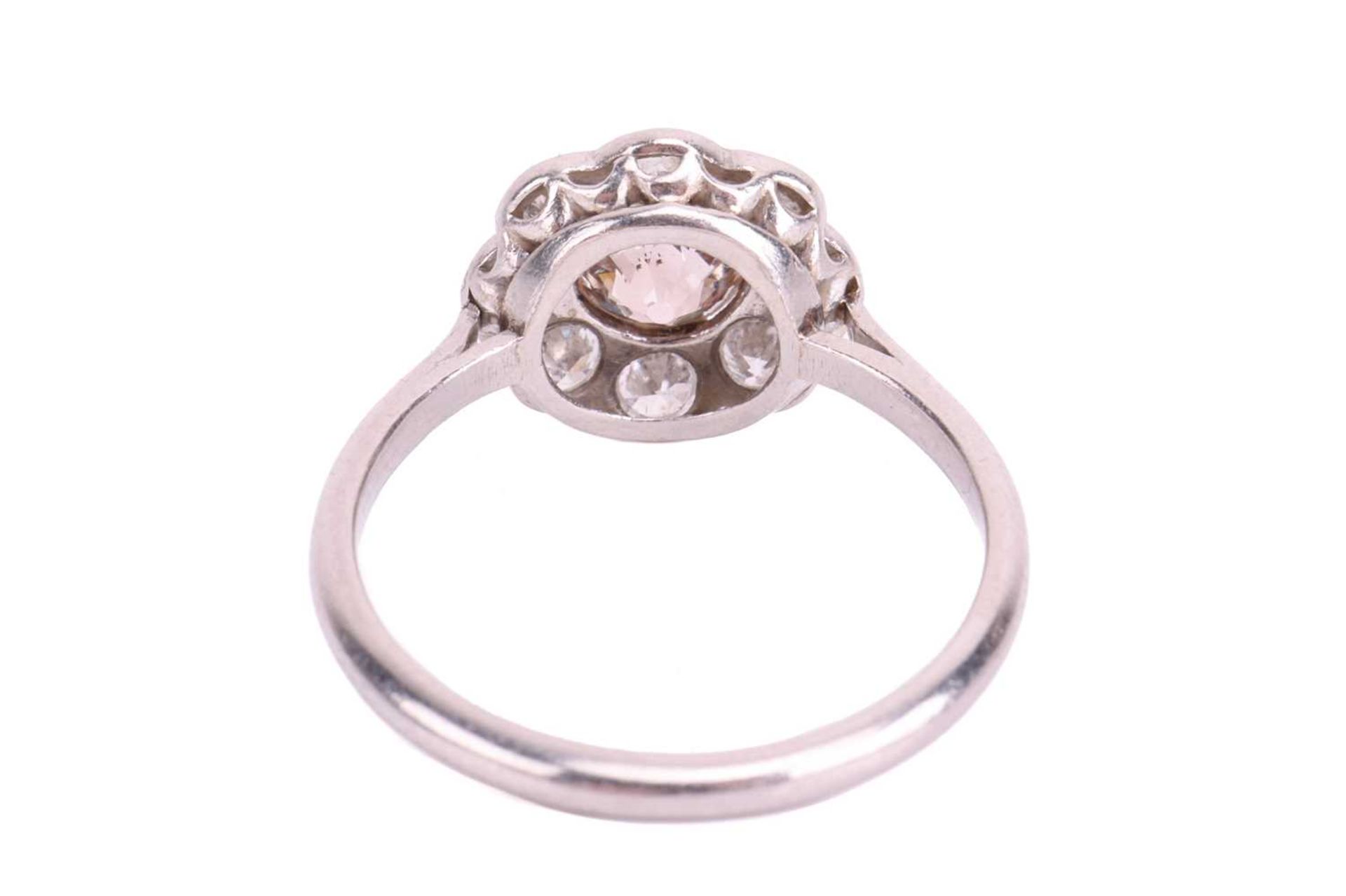 An Edwardian diamond daisy cluster ring, centred with an old European round diamond of "Very Light P - Image 3 of 4