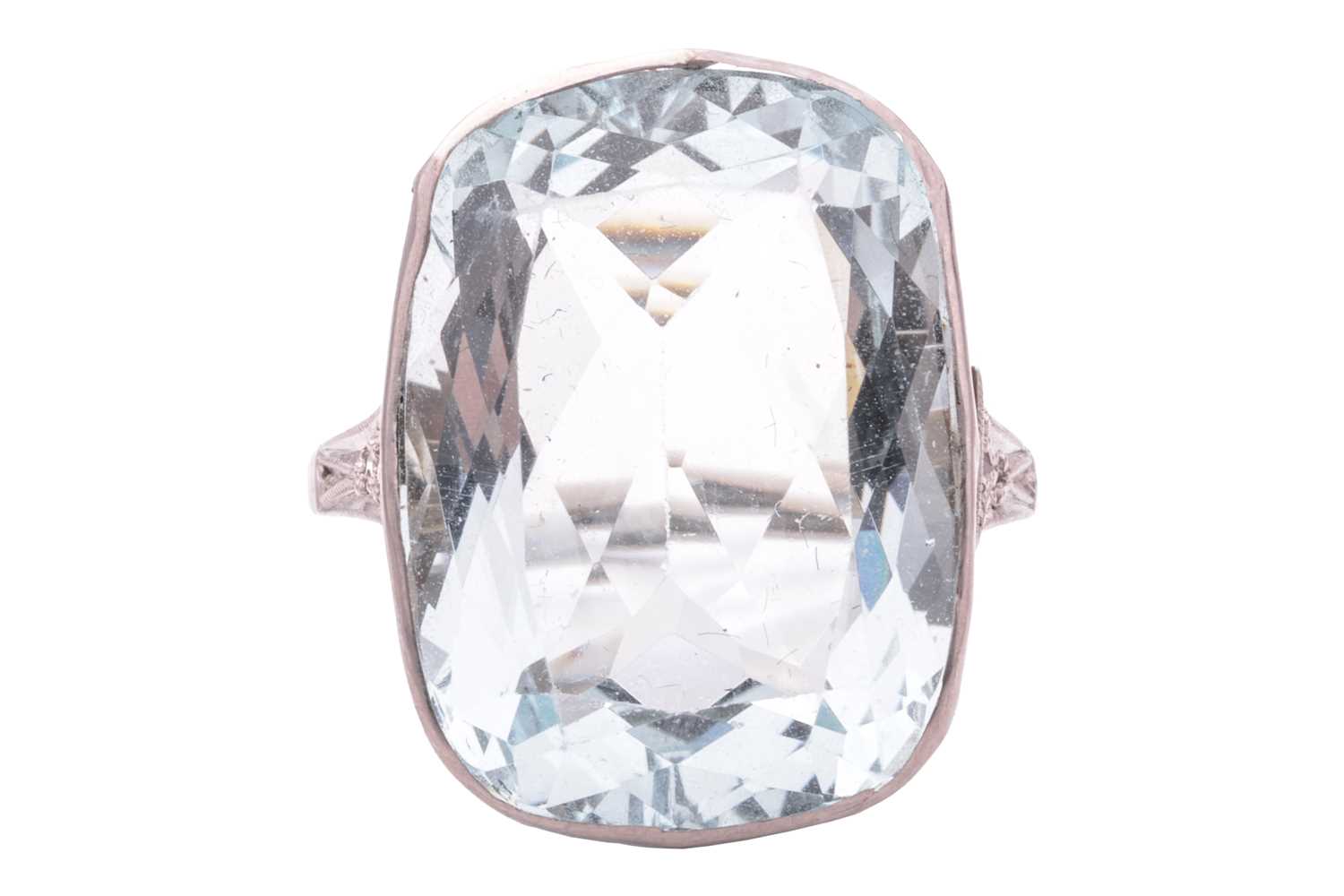 A large aquamarine dress ring, collet-set with a cushion-cut aquamarine of 19.0 x 14.0 x 7.5 mm, mil