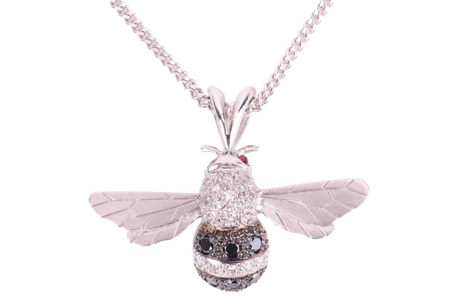 An 18ct white gold and diamond-set bee pendant on chain, sculpted as a realistic bee, thorax encrust