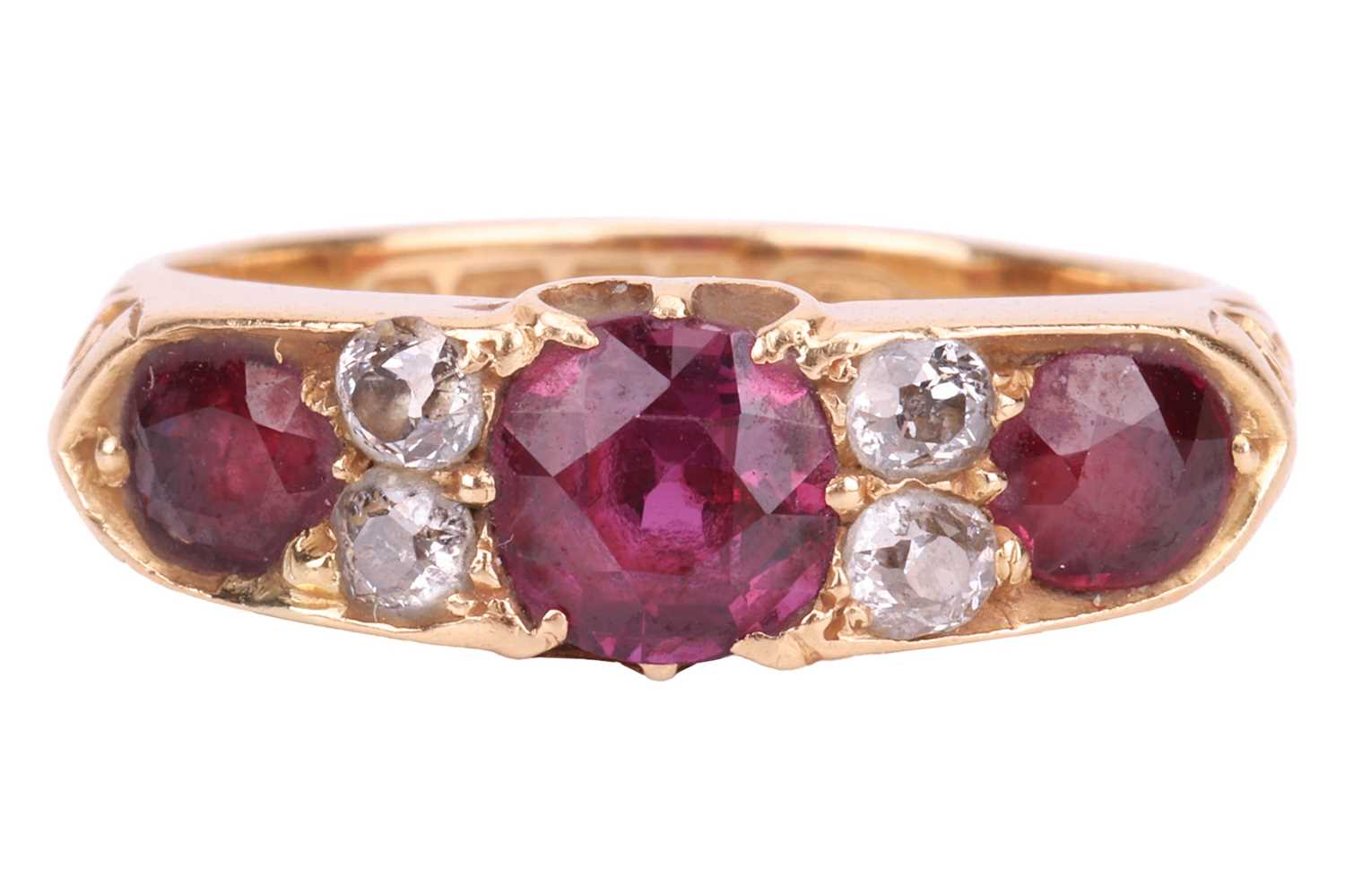 A late Victorian ruby and diamond half-hoop ring in 18ct gold, comprising three graduated circular-s