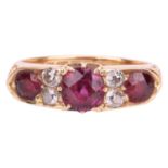 A late Victorian ruby and diamond half-hoop ring in 18ct gold, comprising three graduated circular-s