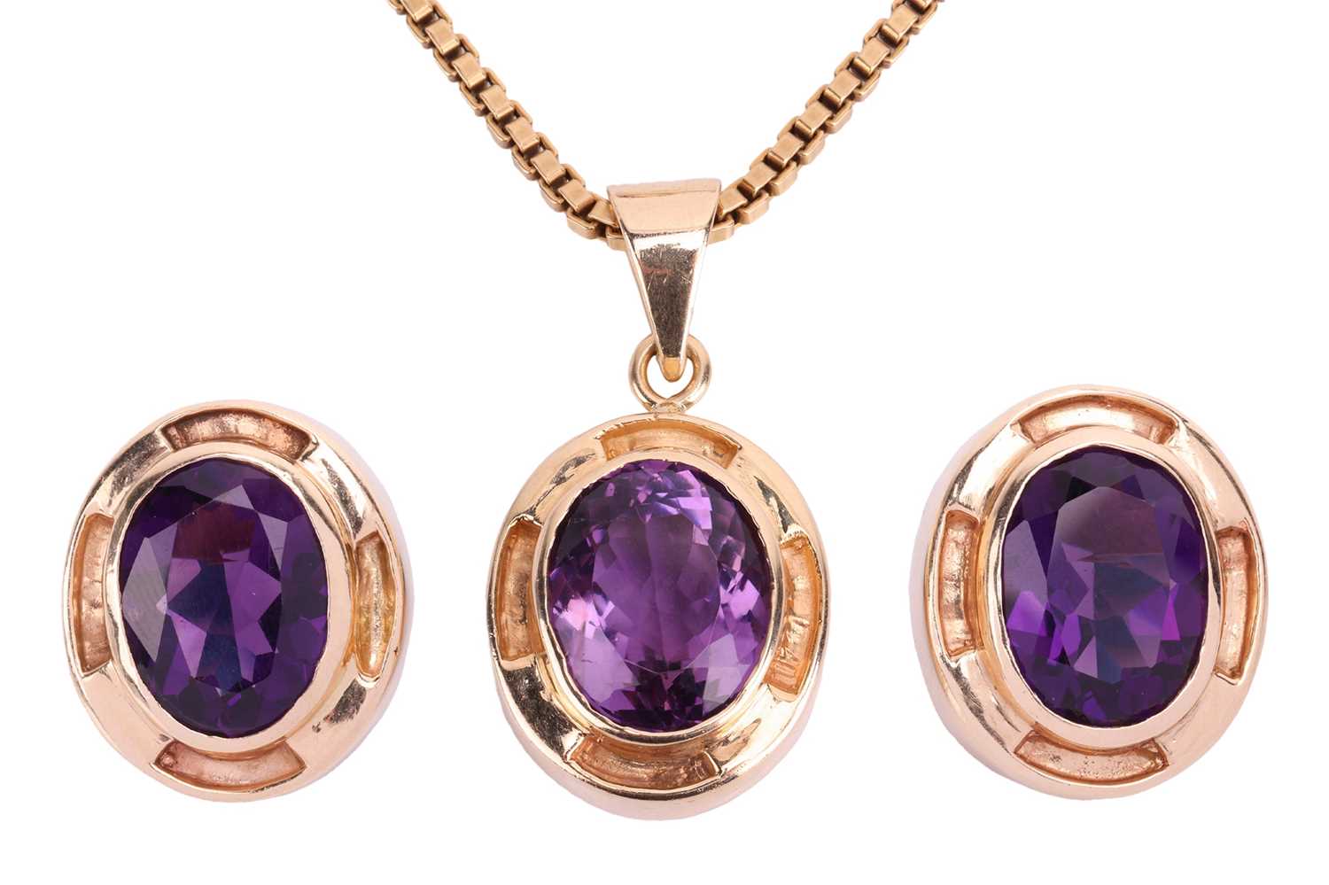 An amethyst earring and pendant necklace suite; each earring set with an oval amethyst measuring 15.