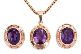 An amethyst earring and pendant necklace suite; each earring set with an oval amethyst measuring