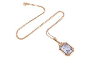 A Swedish single stone synthetic blue spinel pendant, the mixed-cut rectangular stone in four