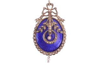 A Victorian enamel and seed pearl brooch, the oval panel with textured work and blue enamel, applied