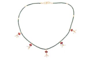 An Indian hardstone beaded fringe necklace, suspending five double-sided polychromatic enamel and