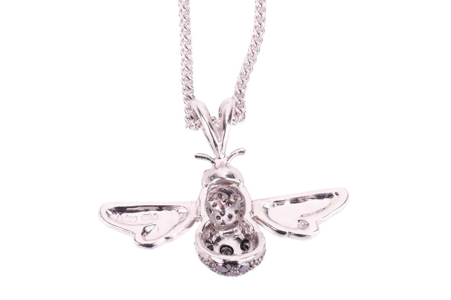 An 18ct white gold and diamond-set bee pendant on chain, sculpted as a realistic bee, thorax encrust - Image 4 of 4