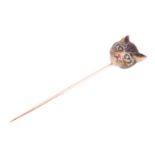 An Edwardian cat head enamel stick pin, sculpted as a realistic head of a tabby cat, painted with fi