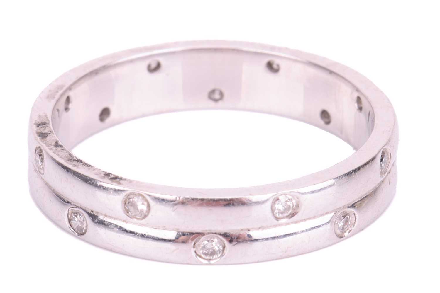 An 18ct white gold diamond-set ring, the double row band flush-set with sixteen round brilliant diam - Image 4 of 4