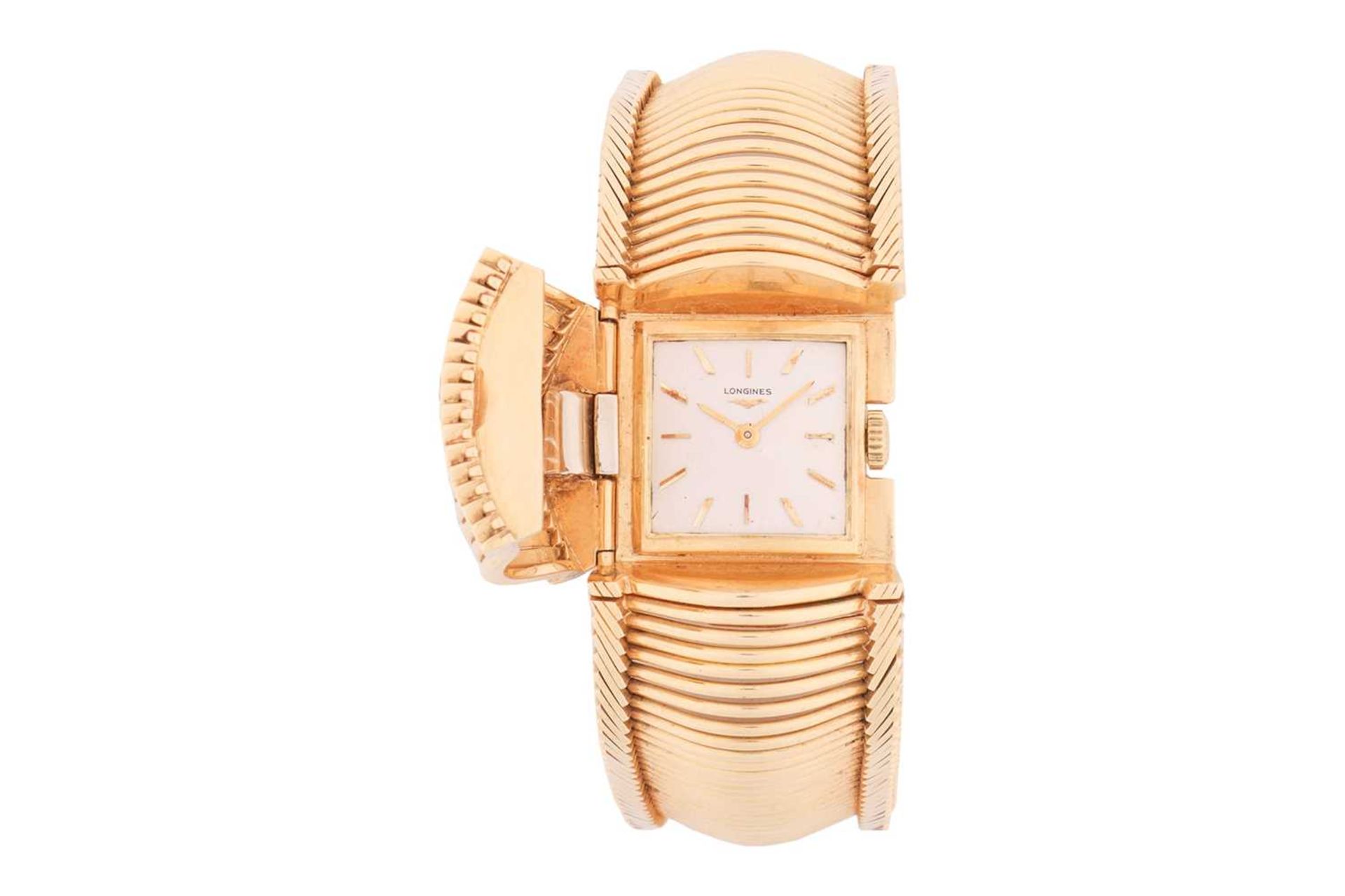 Longines. An 18 carat gold cocktail watch with concealed dial. The square champagne dial with applie