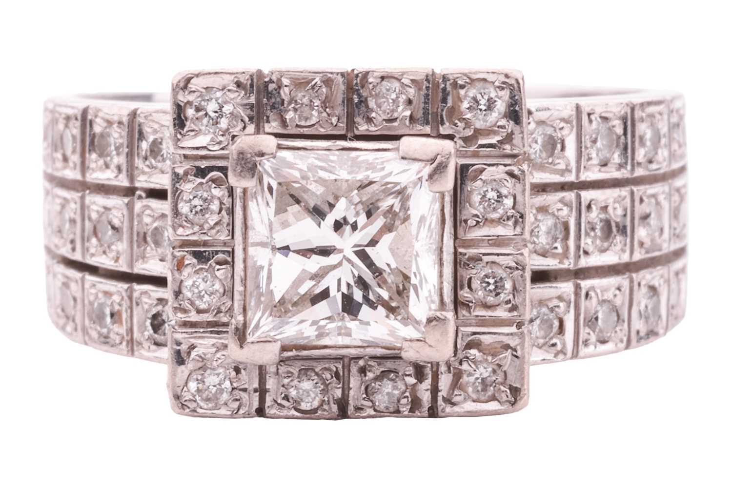 A princess-cut diamond cluster ring, featuring a princess-cut diamond with an estimated weight of 0.