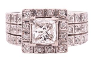 A princess-cut diamond cluster ring, featuring a princess-cut diamond with an estimated weight of