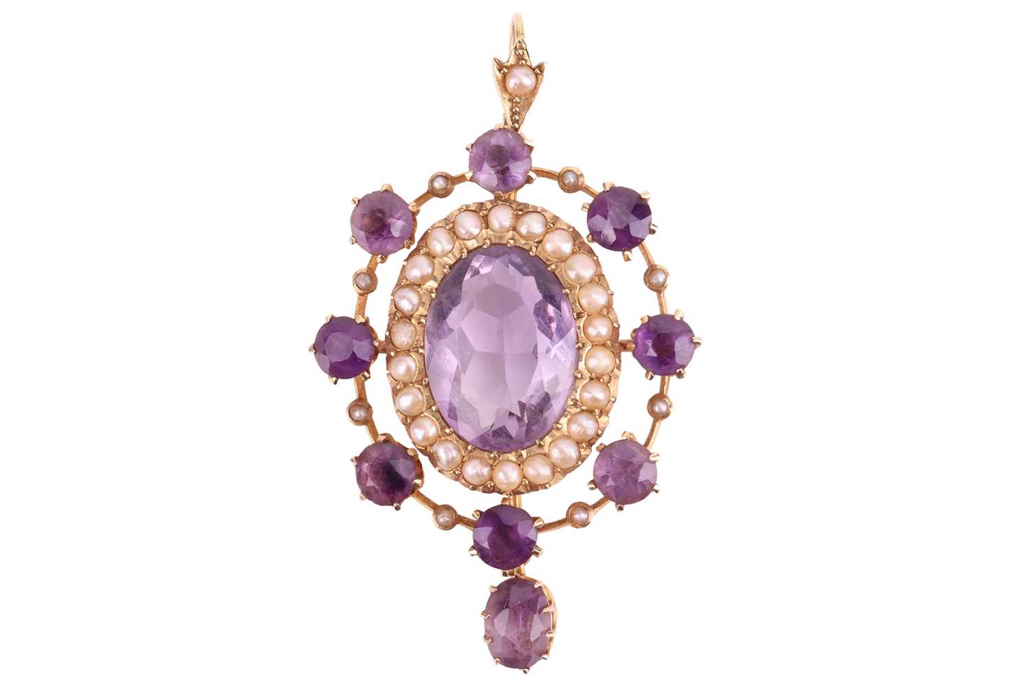 An Edwardian amethyst and seed pearl pendant, the central oval amethyst measuring approximately 13.5