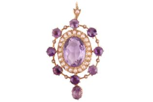 An Edwardian amethyst and seed pearl pendant, the central oval amethyst measuring approximately 13.