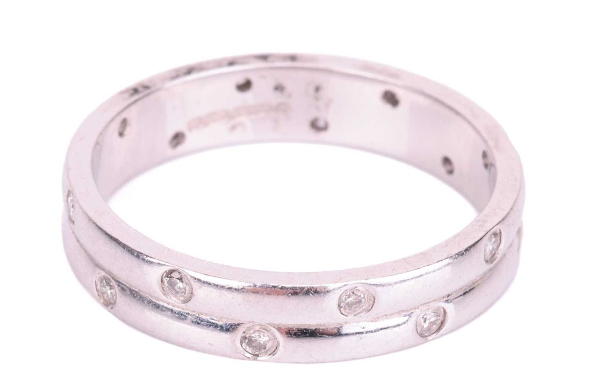 An 18ct white gold diamond-set ring, the double row band flush-set with sixteen round brilliant diam - Image 2 of 4