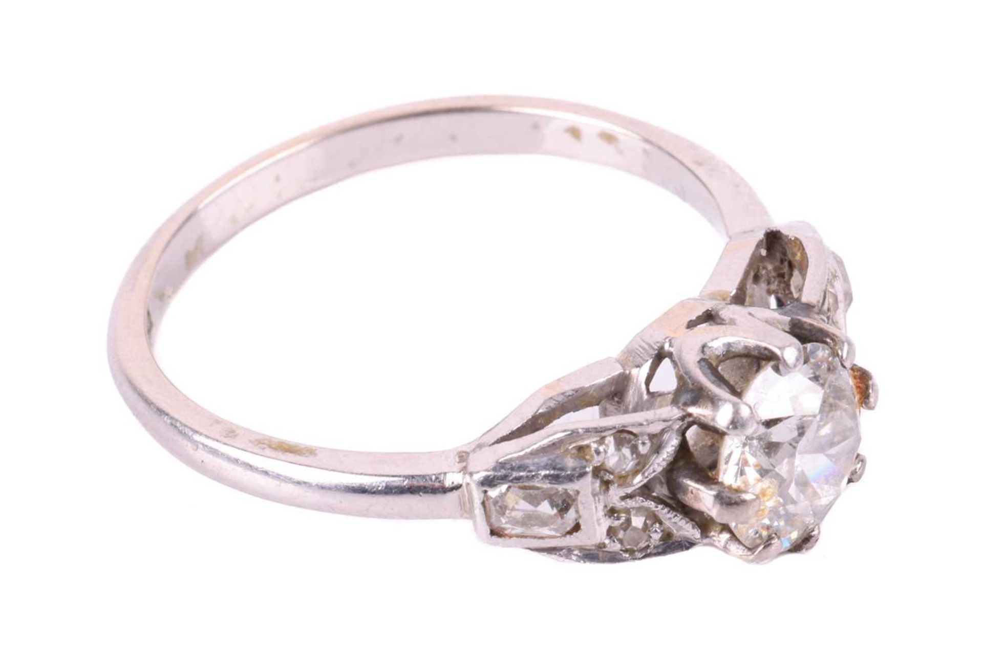 An old cut diamond solitaire ring with diamond set shoulders, circa 1920s, featuring a round old cut - Image 2 of 5