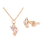 A cubic zirconia leaf ring and a cubic zirconia pendant necklace; the ring set with CZ in a curling 
