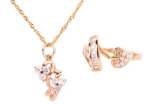 A cubic zirconia leaf ring and a cubic zirconia pendant necklace; the ring set with CZ in a