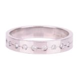 A diamond half eternity ring in platinum, set with a central row of eleven round brilliant cut diamo