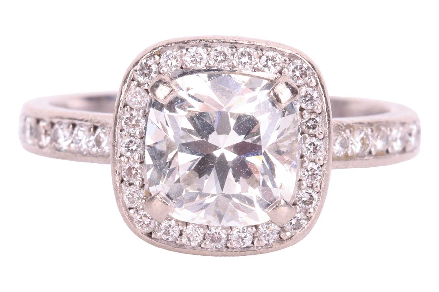 Theo Fennell - a diamond halo ring in 18ct white gold, centred with a cushion-cut diamond