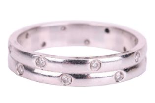 An 18ct white gold diamond-set ring, the double row band flush-set with sixteen round brilliant