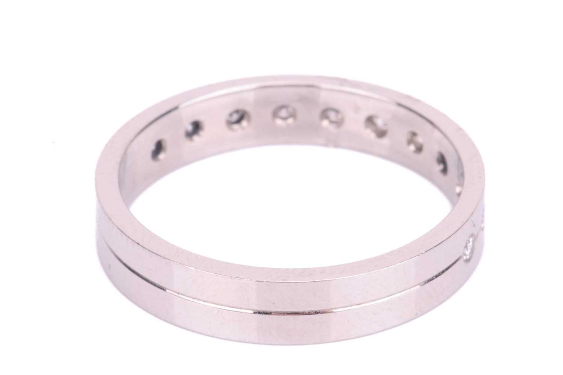 A diamond half eternity ring in platinum, set with a central row of eleven round brilliant cut diamo - Image 4 of 5