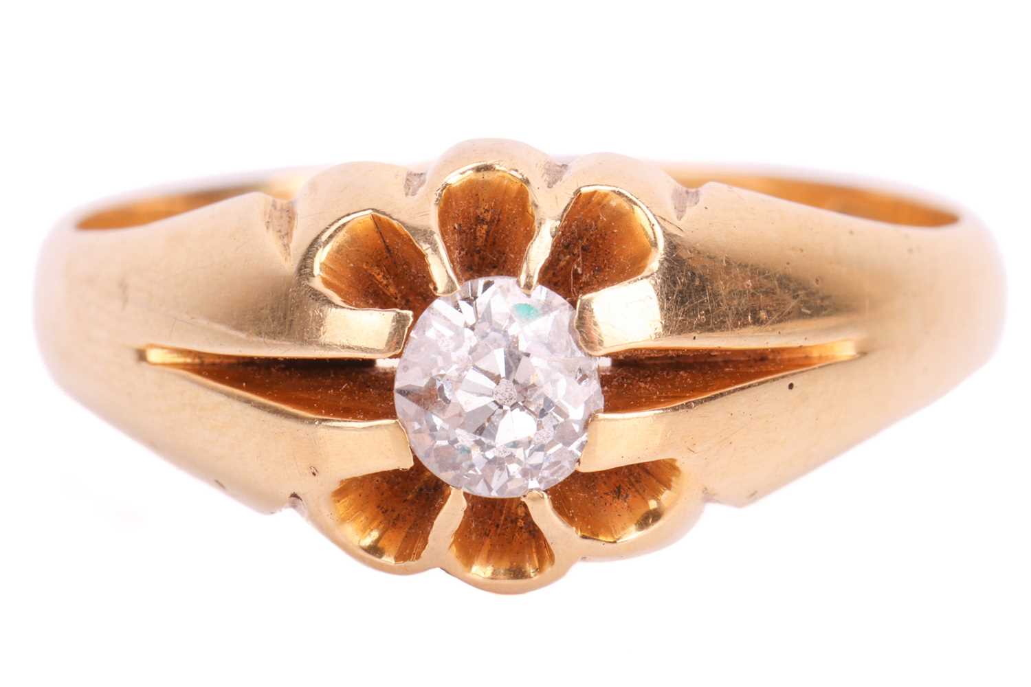 A diamond-set gypsy ring in 18ct yellow gold, centred with an oval old-cut diamond approximately mea