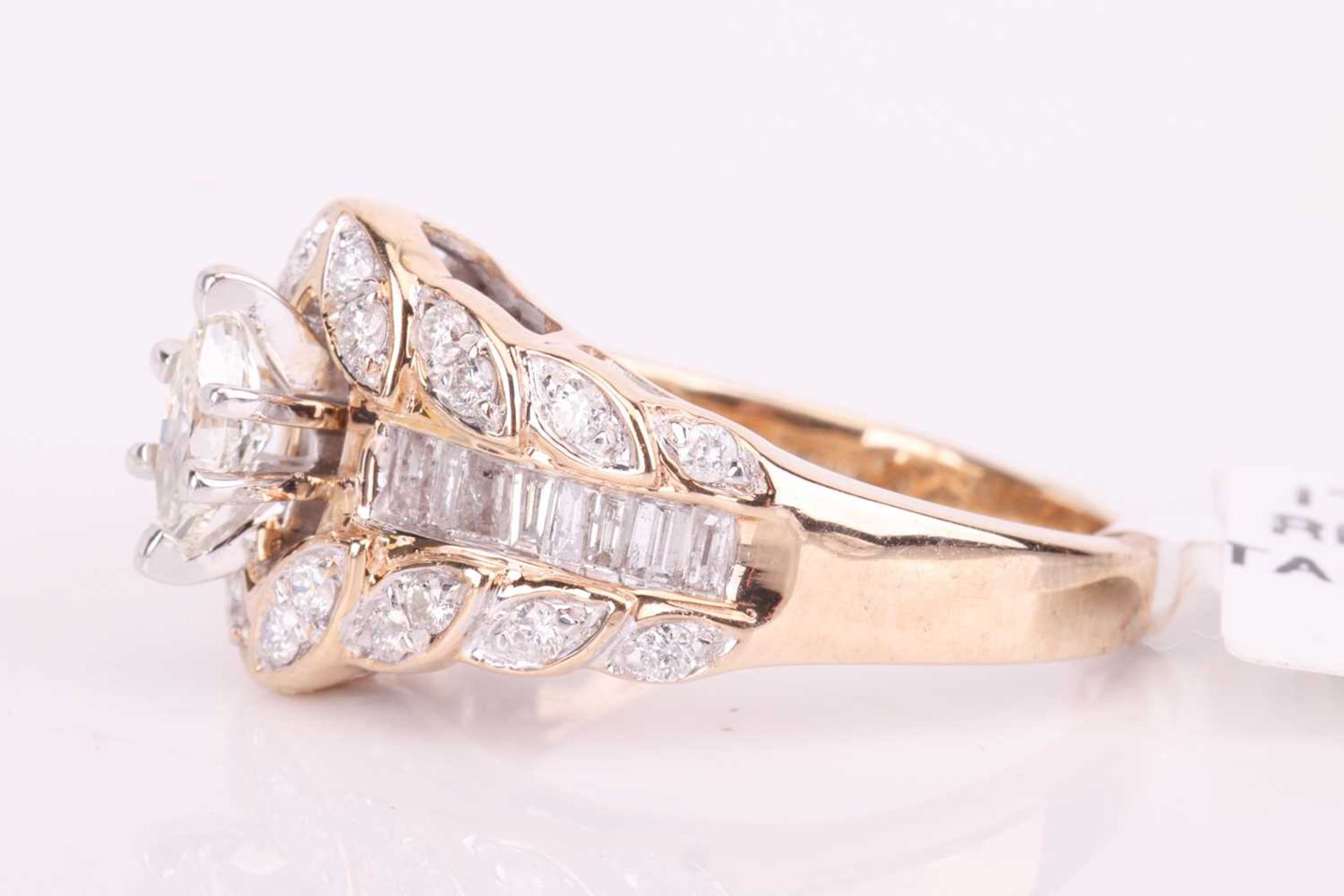 A diamond cluster dress ring in 9ct gold, centred with a marquise-cut diamond in claw setting, betwe - Image 2 of 7