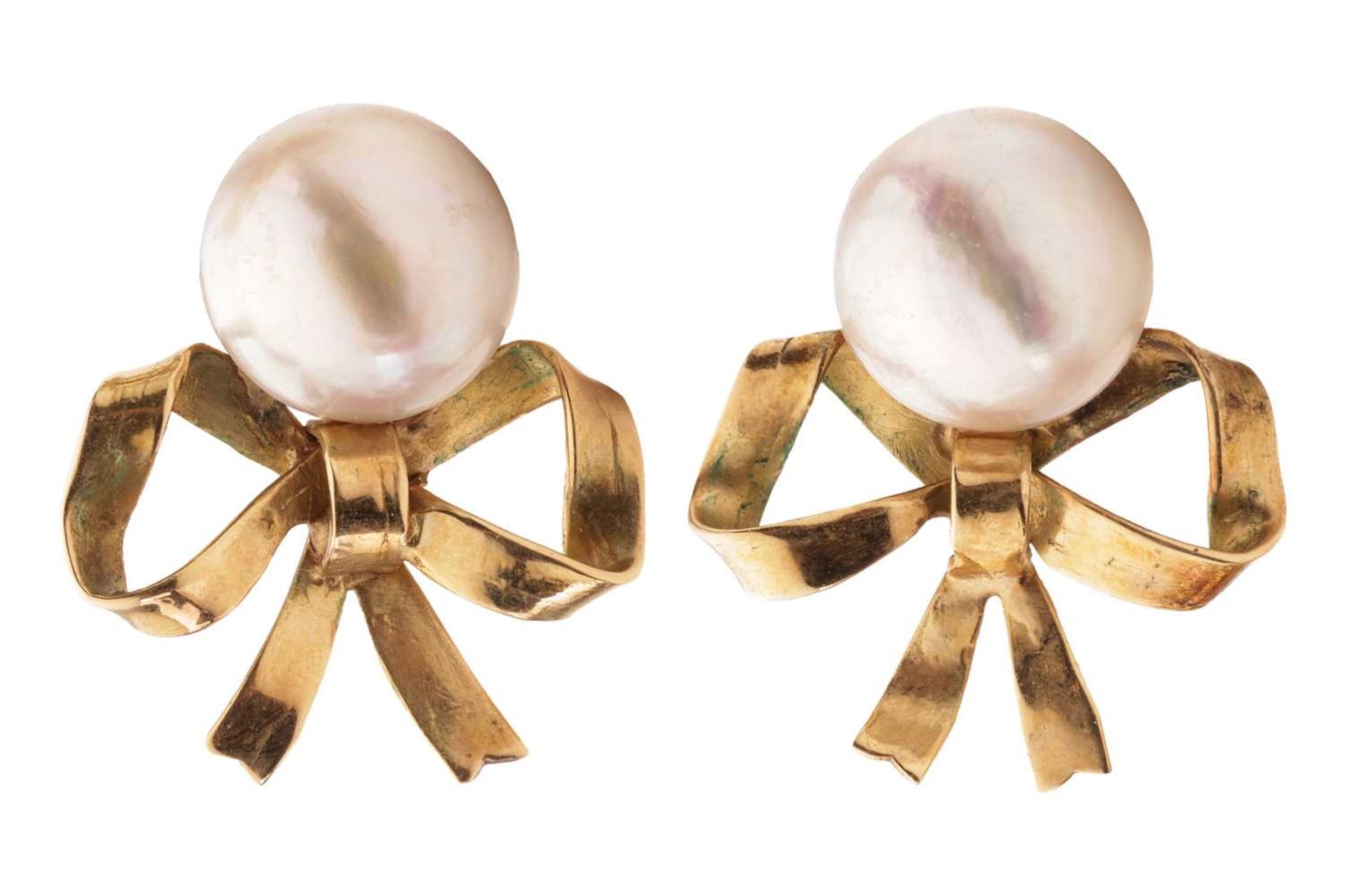 A pair of mabé pearl earrings, each 10.7mm white mabé pearl surmounting a bow, mounted in 18ct yello