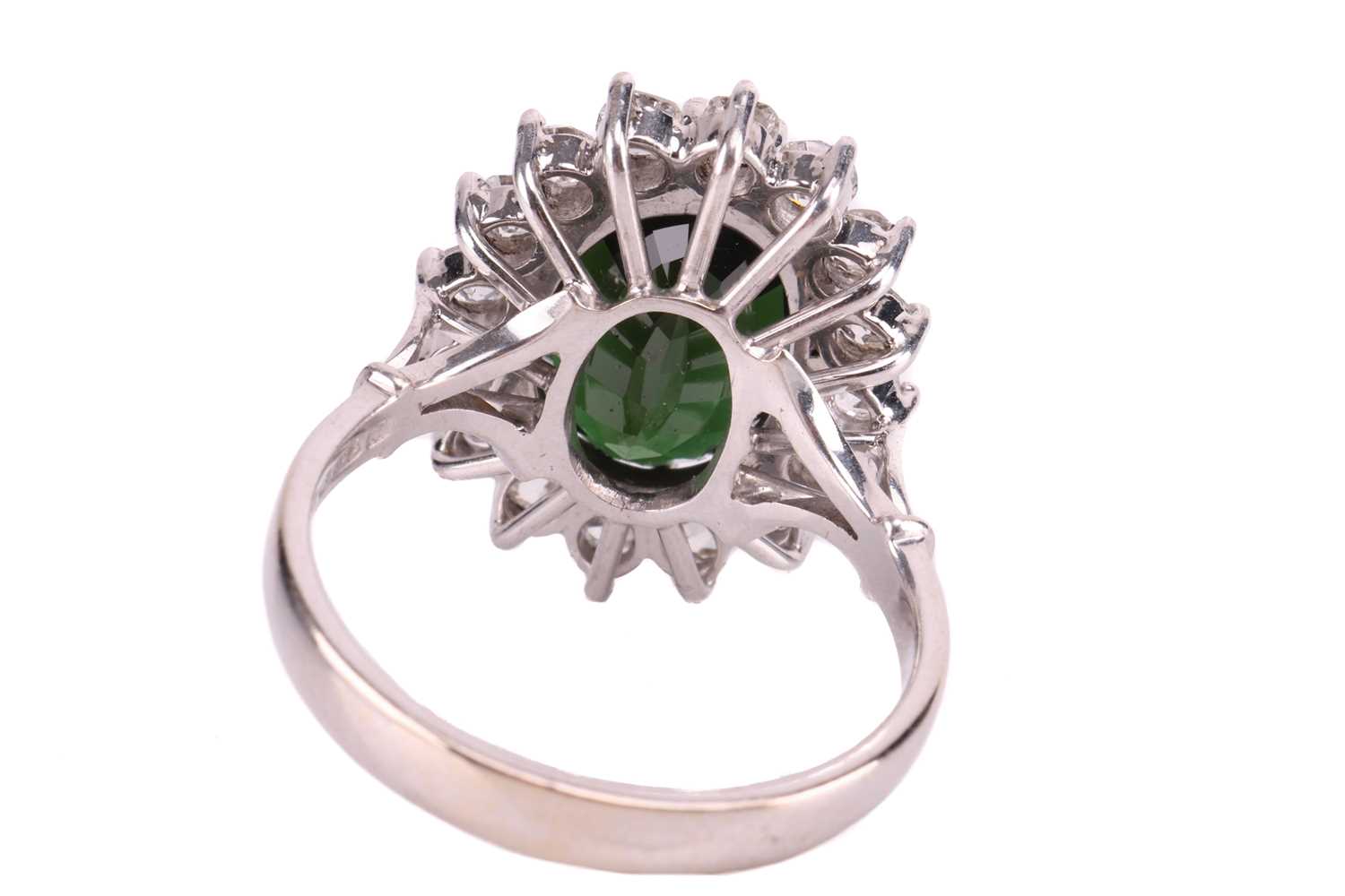 A tourmaline and diamond-set cluster ring, featuring an oval mixed-cut green tourmaline, measuring a - Image 4 of 4