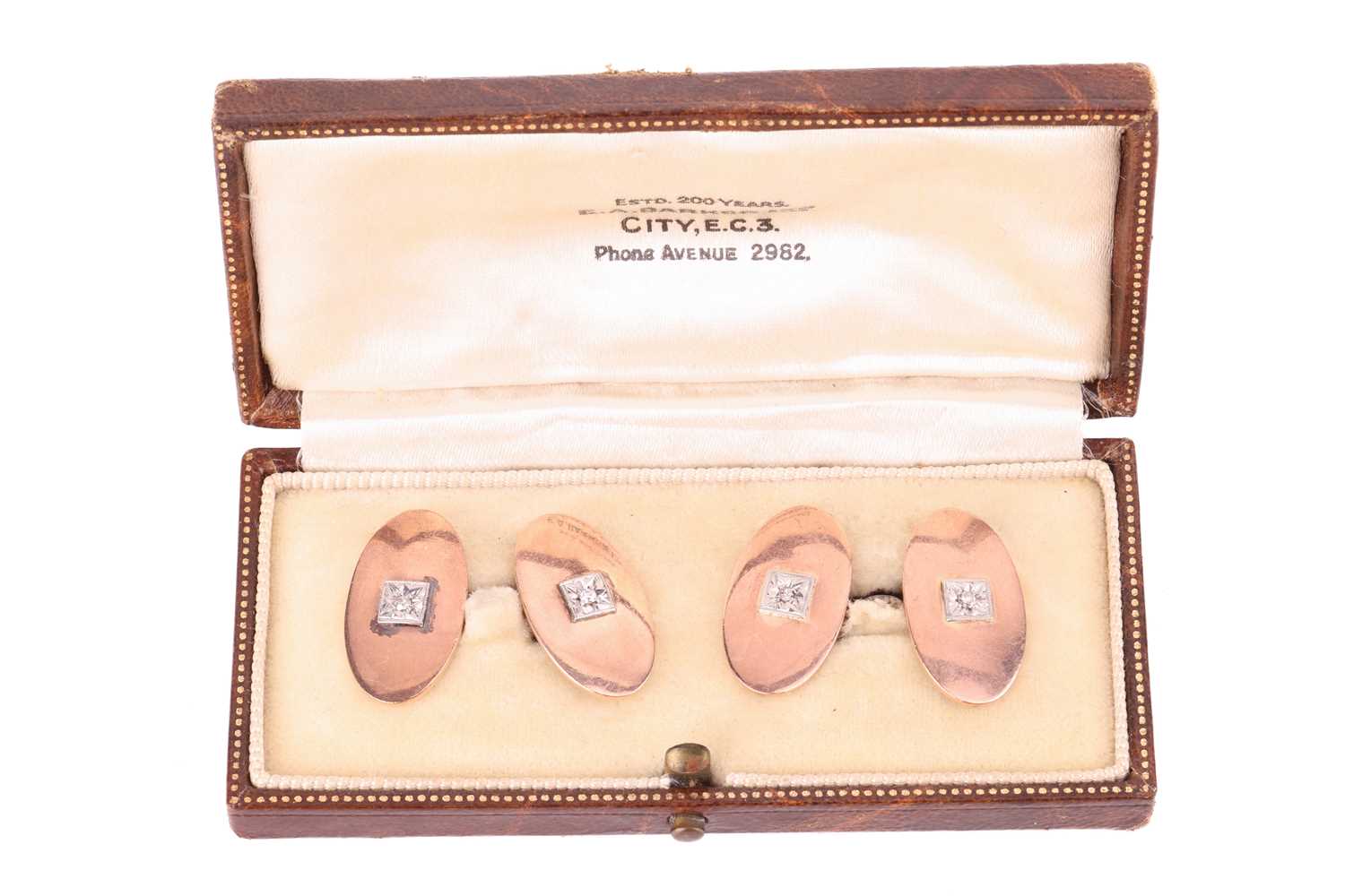 A cased pair of diamond-set cufflinks, each oval panel centred with a square plaque and star-set wit - Image 3 of 3