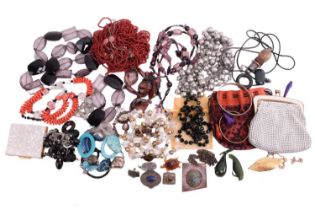 A collection of costume jewellery, including a pair of nephrite animal ornaments, beaded necklaces, 