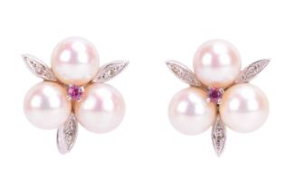 A pair of 9ct white gold floral style pearl set studs, featuring three cultured pears with a central