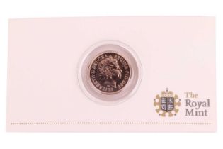 A 2010 Elizabeth II full gold sovereign cased and uncirculated with Royal Mint paper case